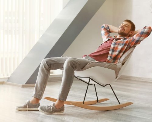 man-relaxed-on-rocking-chair