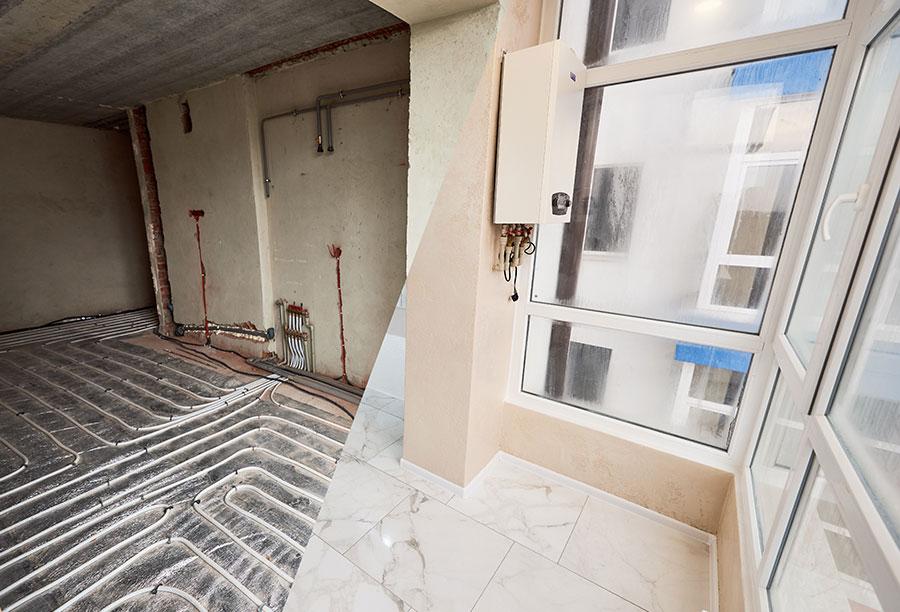 Comparison-of-room-with-underfloor-heating-in-progress-and-completed Comparison of room with underfloor heating in progress and completed